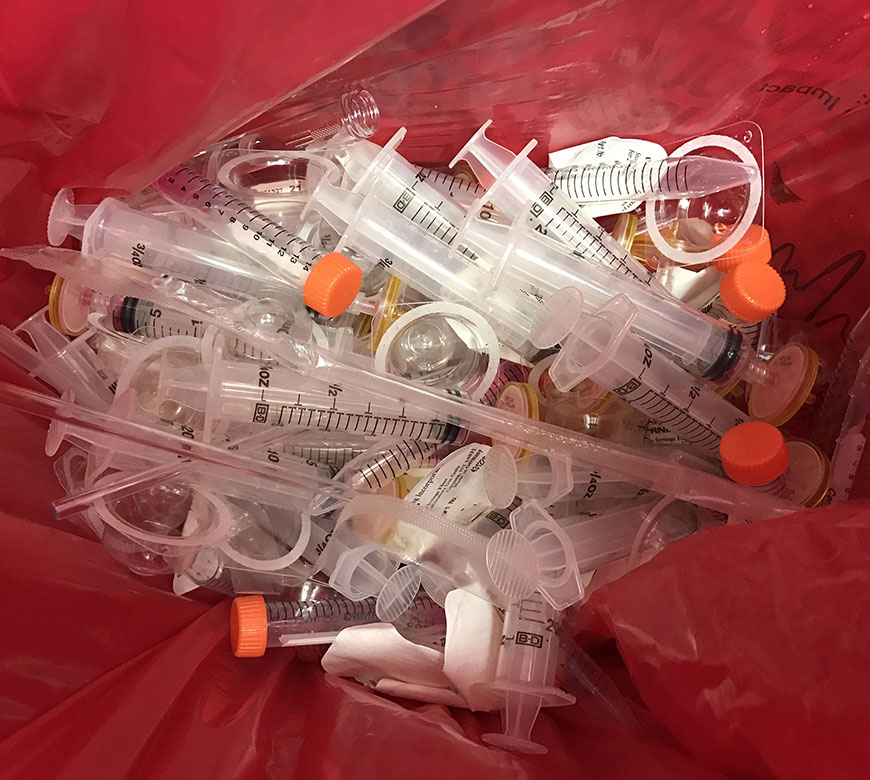 Discarded syringes and other medical waste ready for laboratory waste disposal in Atascocita, TX